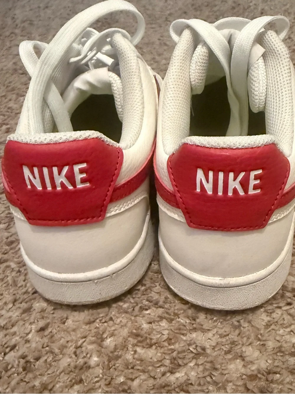 Nike women’s White Leather Sneakers with Red Swoosh